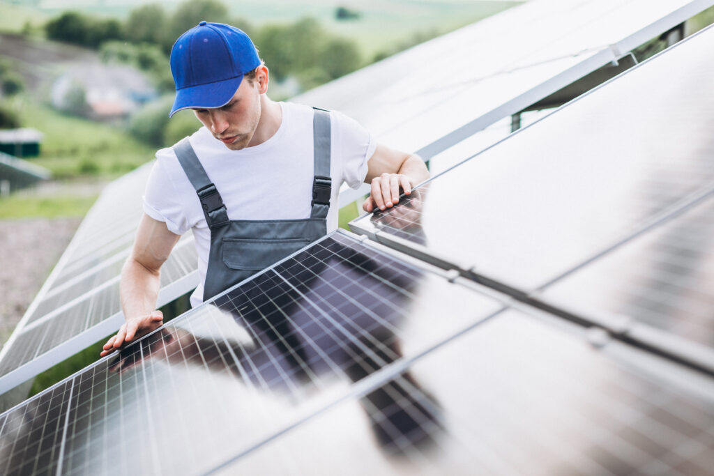 man worker firld by solar panels 1